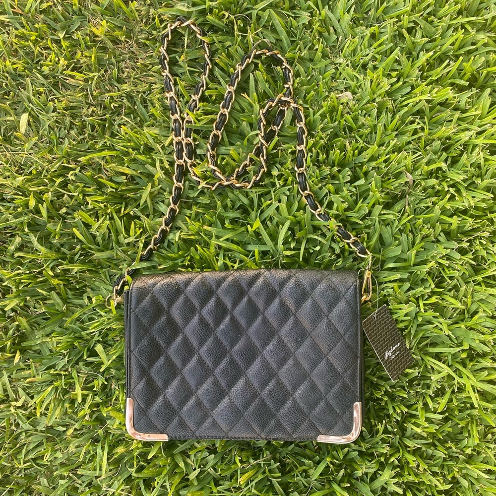 Black flap bag with gold accents
